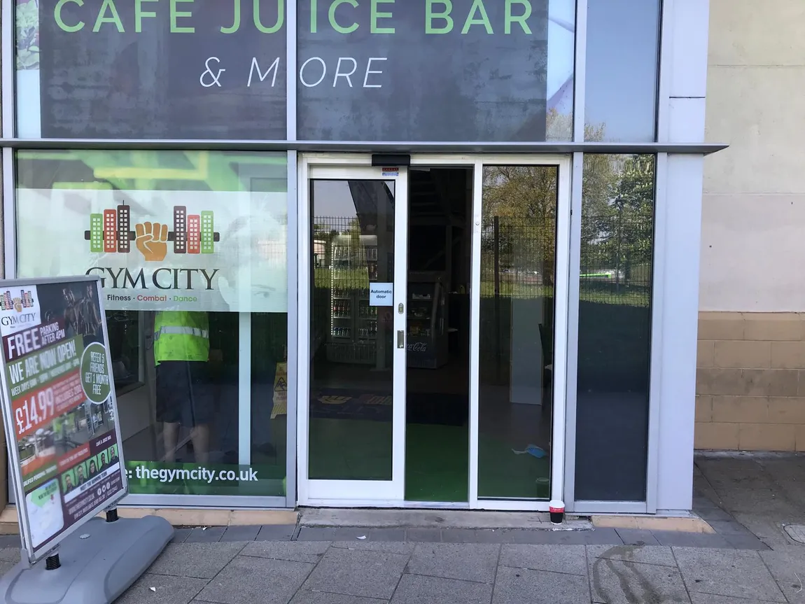 Automatic sliding entrance doors installed at a gym and juice bar
