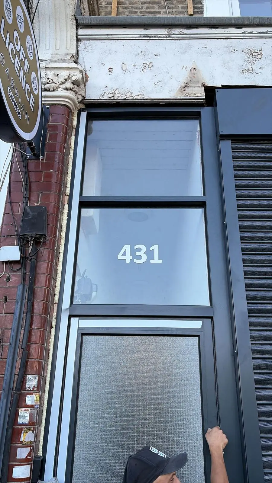Tall glazed aluminium commercial entrance door installed in London by Range Shop Fronts
