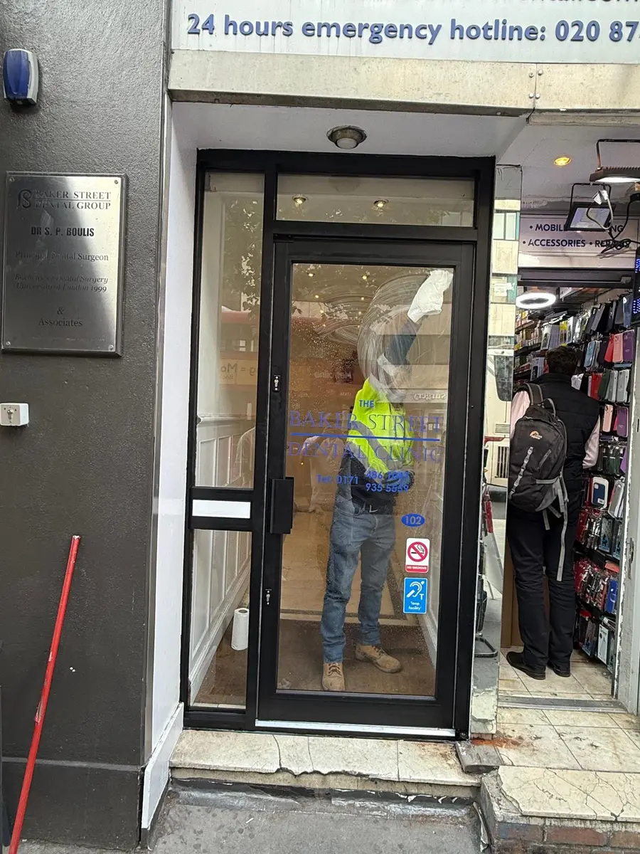 Glazed aluminium single entrance door on a London shop by Range Shop Fronts