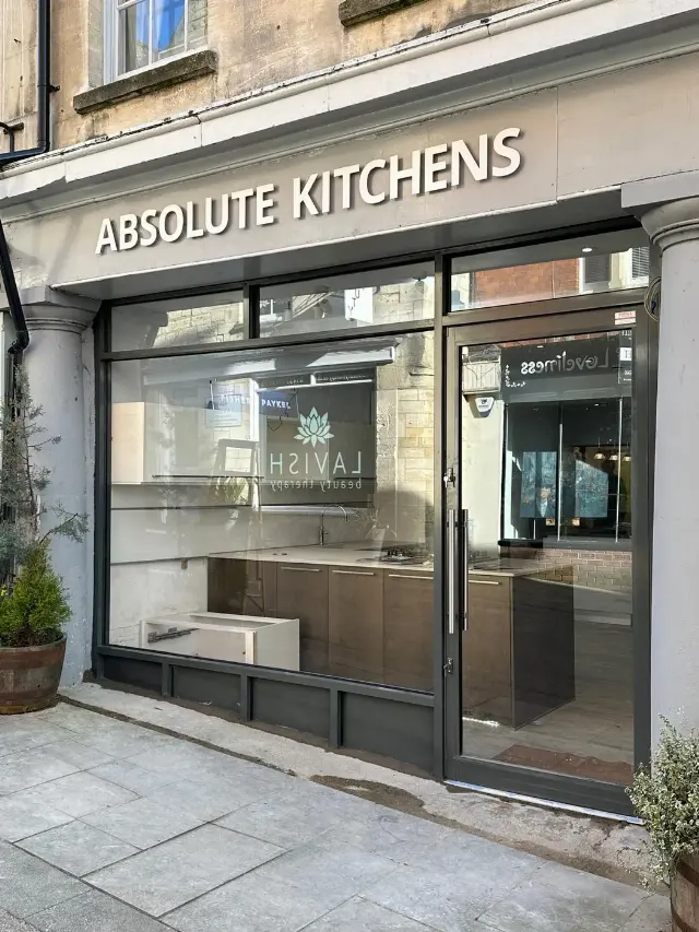 Dark aluminium framed glass shopfront for the Absolute Kitchens showroom