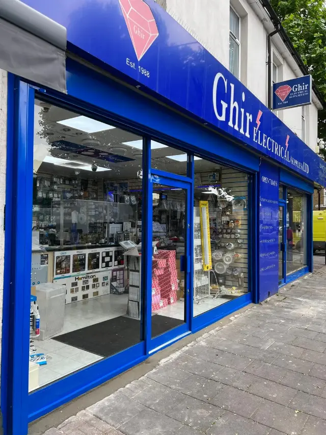 Blue aluminium shopfront with display glazing for Ghir Electricals