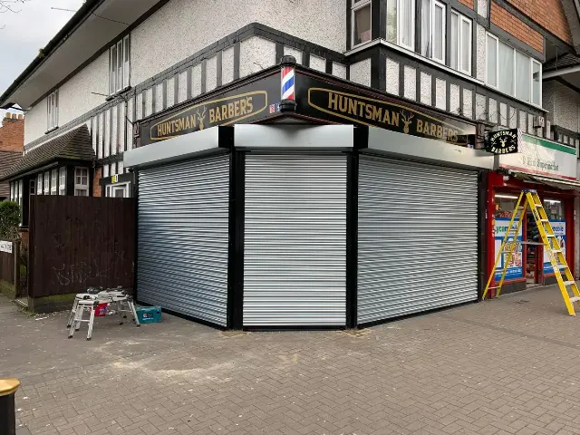 Corner roller shutters installed for Huntsman Barbers