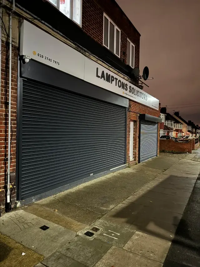 Grey roller shutter for the Lamptons Solicitors office