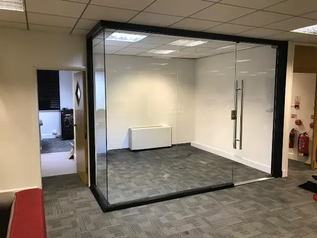 Frameless glass meeting room partition