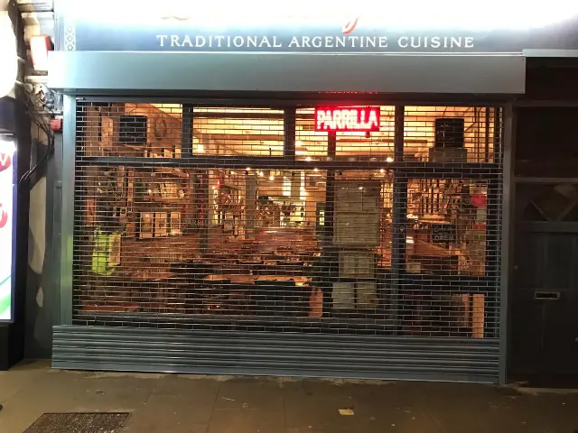 Rolling grill shutter on a restaurant frontage