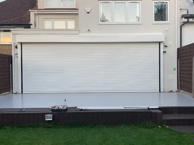 White domestic patio roller shutter installation