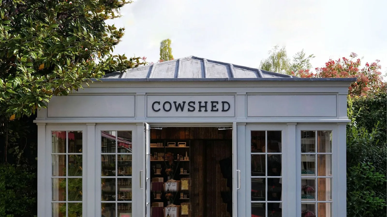 Classic white timber shop front with traditional glazing bars